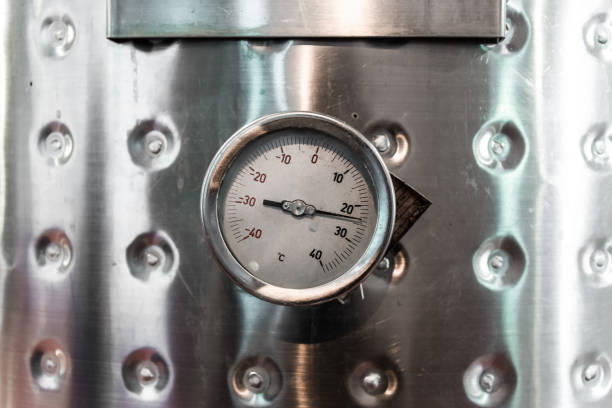 istock Thermometer on a steel wine tank for wine fermentation at a winery 1214614130