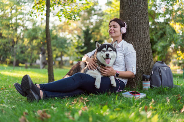 istock Woman hugging and relaxing with her dog 1214614381