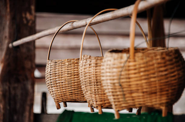 istock Asian style Wicker bamboo rattan basket with wooden handle 1214616390
