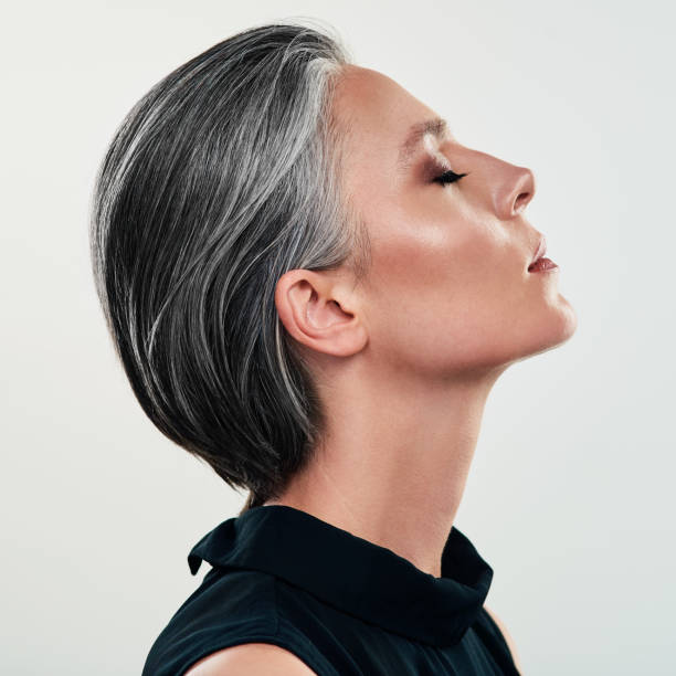 Real beauty is to be true to oneself Studio shot of a beautiful mature woman posing against a grey background middle aged woman fashion stock pictures, royalty-free photos & images