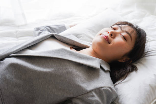 istock Young business woman take a nap at work 1214617199