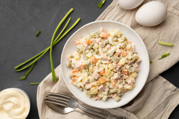 istock Russian salad Olivier with mayonnaise on plate. 1214619020
