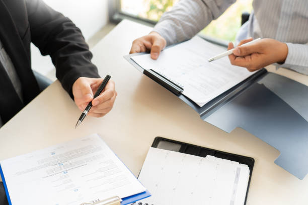 istock Job Interview and hiring concept, Appointment candidate Business man explaining about his profile and answer to Human resources manager sitting at a table opposite in the office 1214621026