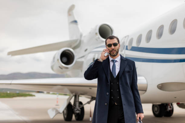 istock Businessman travelling by executive jet 1214623026