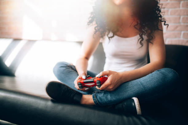 istock girl plays video games 1214625279