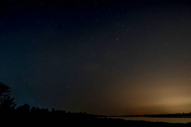 istock Milky way galaxy with stars on a night sky background 1214626337
