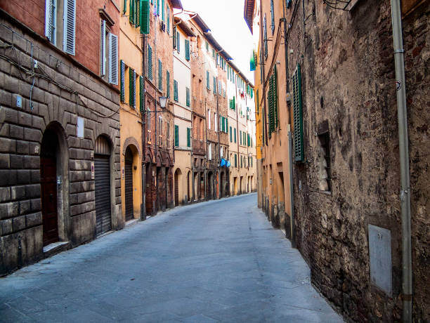 istock Ancient street in Siena, Italy 1214627053