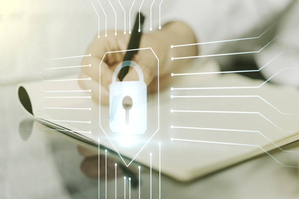 istock Creative idea concept with lock symbol and microcircuit illustration and with man hand writing in notebook on background. Protection and firewall concept. Multiexposure 1214627233
