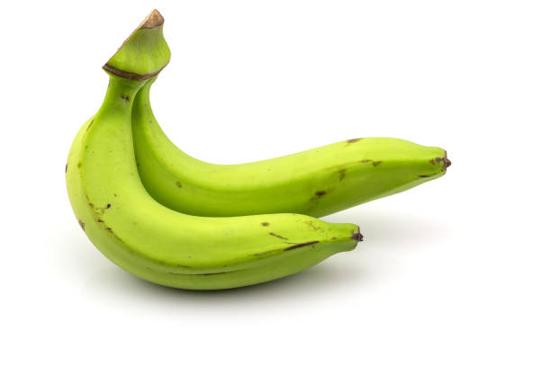 istock Two green banana isolated on white 1214627261