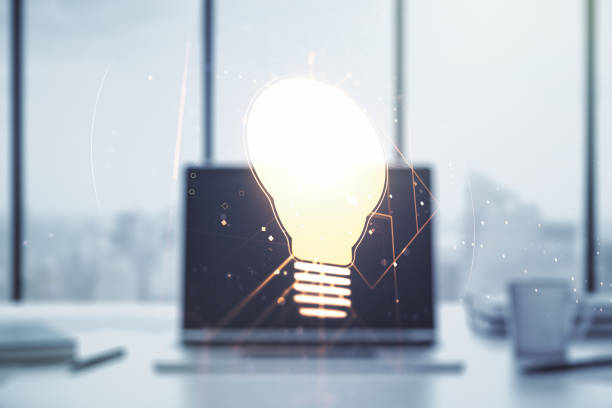 istock Double exposure of creative light bulb hologram on laptop background, research and development concept 1214627556