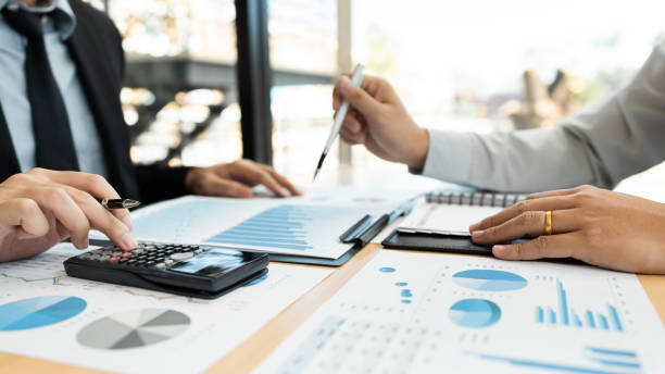 istock Business Corporate team brainstorming, Planning Strategy having a discussion Analysis investment researching with chart at office his desk documents and saving concept. 1214628145