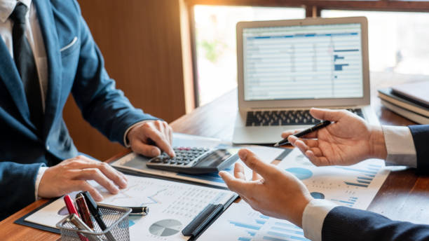 istock Business Corporate team brainstorming, Planning Strategy having a discussion Analysis investment researching with chart at office his desk documents and saving concept. 1214628193