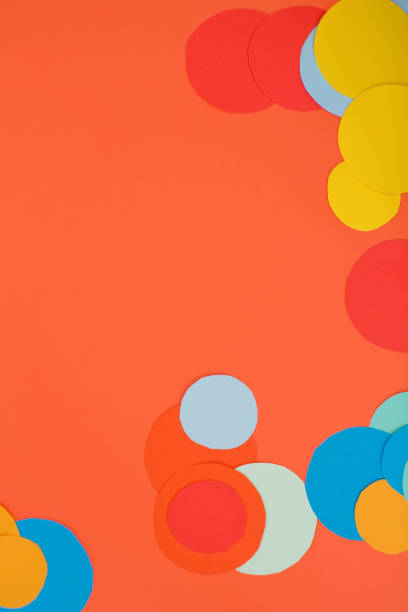 istock Orange background with colorful circles 1214628276