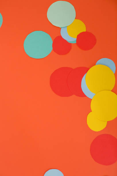 istock Orange background with colorful circles 1214628290