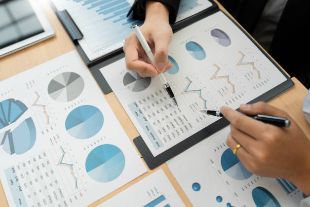 istock Business Corporate team brainstorming, Planning Strategy having a discussion Analysis investment researching with chart at office his desk documents and saving concept. 1214628323