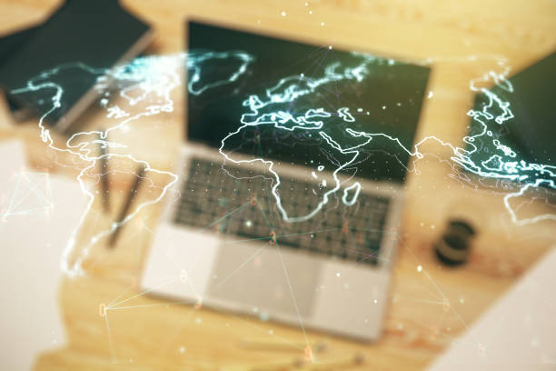 istock Abstract creative world map on modern laptop background, international trading concept. Multiexposure 1214628336