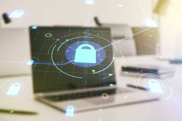 istock Double exposure of creative lock hologram with chip on laptop background. Information security concept 1214628356