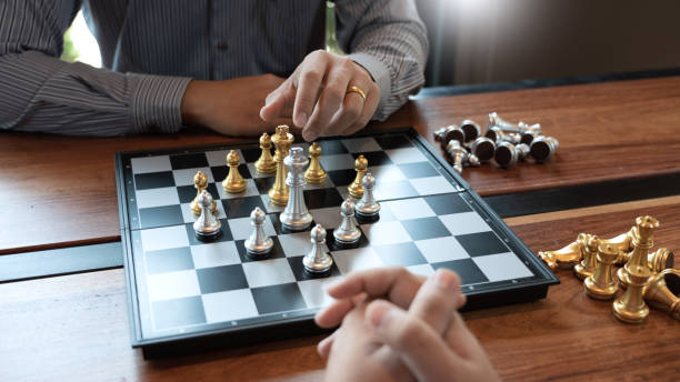 istock Business man moving chess game for business competition and team work concept. 1214628360