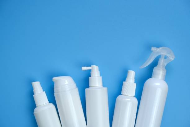 istock Disinfectant Bottle Set. Hand disinfection concept. White plastic bottles on a light blue background. Hygiene and health. Hygiene during the epidemic of coronavirus.Cosmetic bottles Mockup. 1214630486