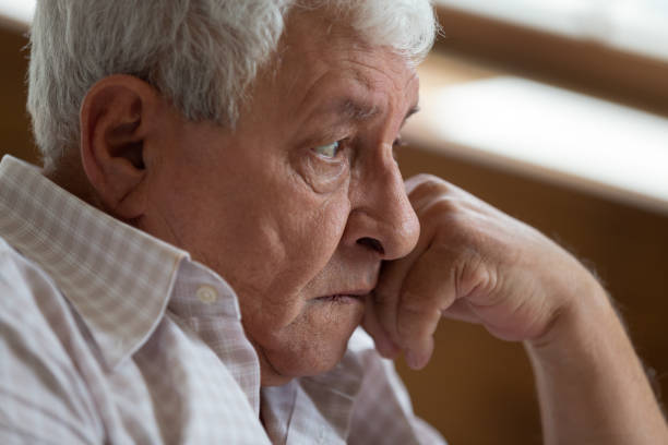 istock Head shot unhappy thoughtful older man lost in thoughts 1214631518