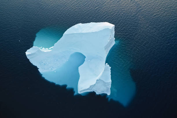 Aerial view of large glacier and iceberg Aerial view of large glacier and iceberg ilulissat photos stock pictures, royalty-free photos & images