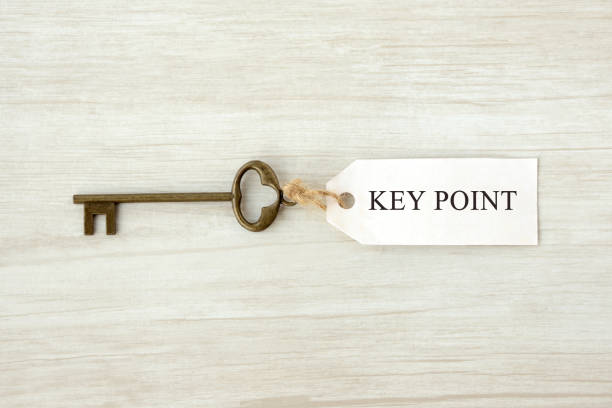 schlüssel mit tag key point wörter werden geschrieben - approved englischer begriff stock-fotos und bilder