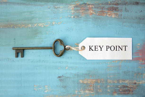 schlüssel mit tag key point wörter werden geschrieben - approved englischer begriff stock-fotos und bilder