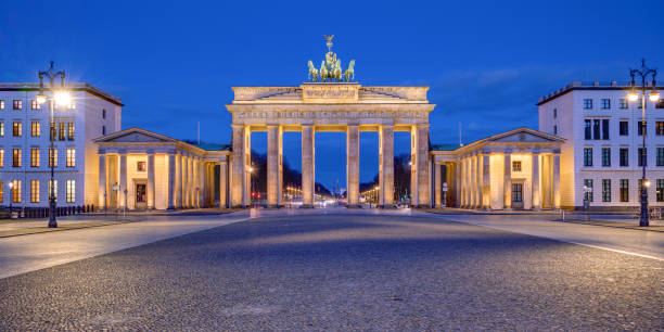istock Panorama of the illuminated Brandenburg Gate 1214633461