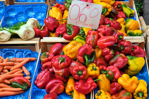 Red and yellow bell pepper for sale at a market