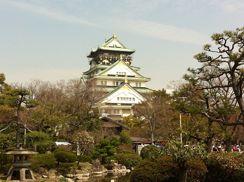 View of Osaka Castle and Japanese garden during Spring in Osaka, Japan. The castle is one of Japan's most famous landmarks.