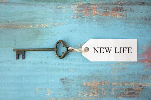 Key with tag NEW LIFE words are written Key with tag NEW LIFE words are written hit the road stock pictures, royalty-free photos & images