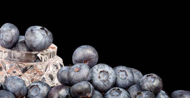 istock heap of blueberry isolated on black background 1214635681