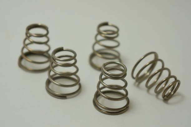 istock Closeup of Stainless Steel Compression Spring Set for industry on white background. 1214636303