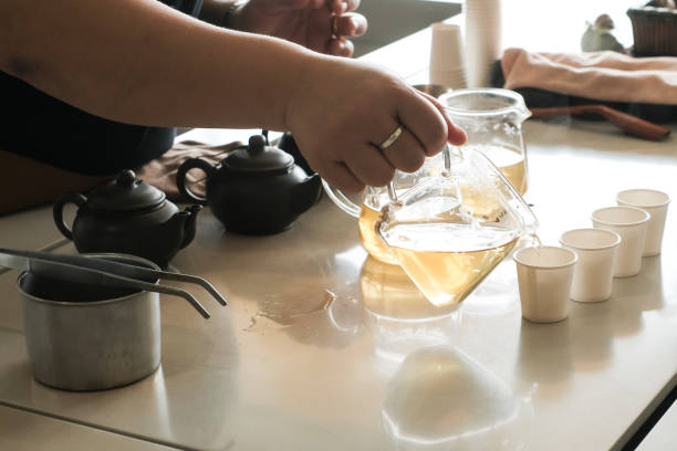 istock side view of a female pouring tea 1214636326