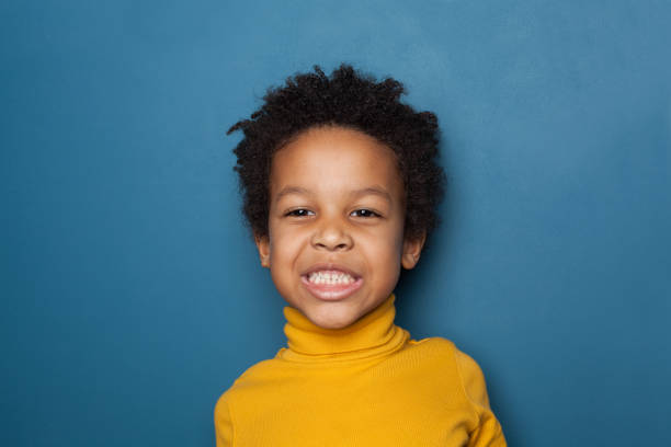 istock Funny small black child boy portrait 1214636950
