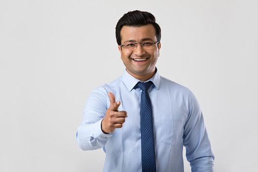 Portrait of smiling businessman over white background