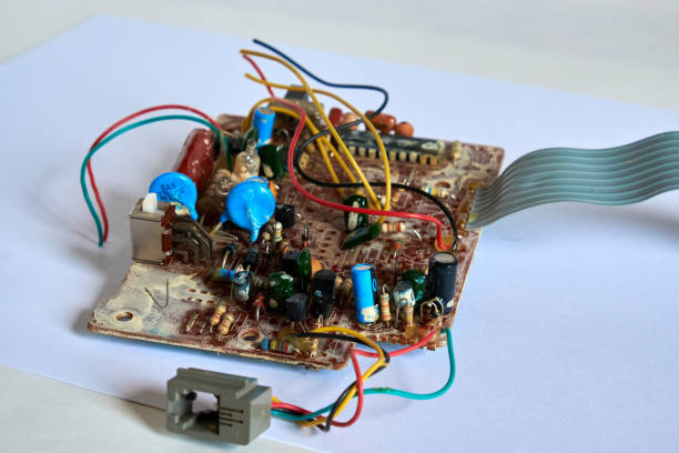 istock Old printed circuit board with many wires and elements. 1214638119