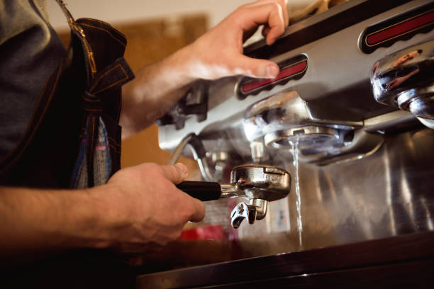 istock close up barista hand making a cup of coffee 1214639782