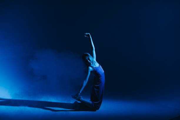 istock Young stylish girl dancing in the Studio on a colored neon background. Classic dancer. 1214639809