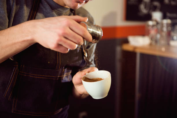 istock Coffee Latte Barista making pattern in a cup of coffee shop. 1214639883