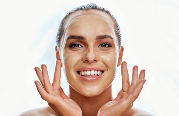 This mask will do the trick Shot of a beautiful young woman wearing a face mask  against a white background facial chemical peel stock pictures, royalty-free photos & images