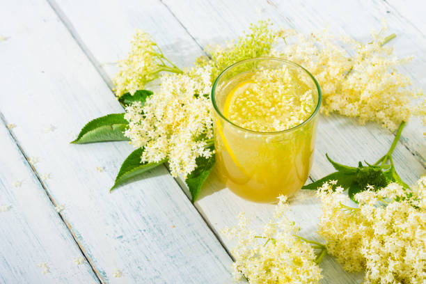 Elderberry juice organic refreshment juice from elderberry blossom on white wooden table date syrup stock pictures, royalty-free photos & images