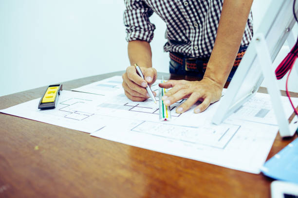 istock Architectural offiice site desk Solar cell background construction project ideas concept.Renewable energy 1214645016
