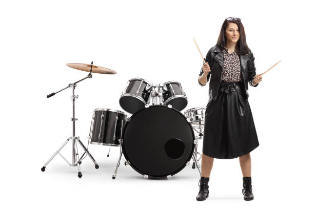 istock Young woman drummer with drumsticks with a drum set 1214646179