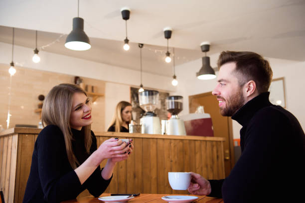 istock Young couple talking in a coffee shop 1214647702