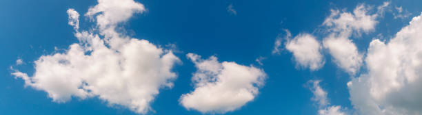 istock Panorama blue sky fluffy white cloud summertime on light sunny day cloudscape. Clear bright blue skyline sunlight climate panoramic background. Heaven blue environment ecology scenic nature background 1214648318