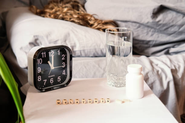istock beautiful curly haired woman sleeping in bed. 1214650185