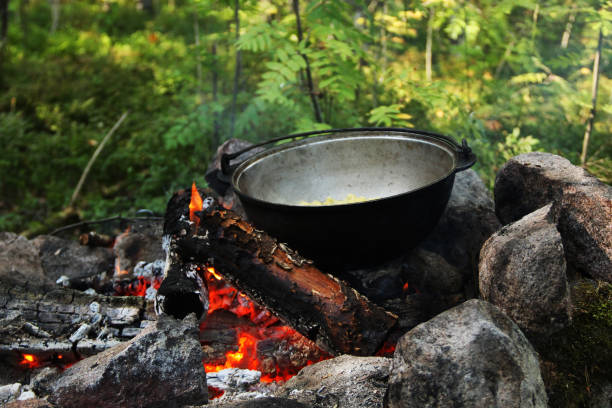 istock tourist bowler with food on the campfire 1214652448