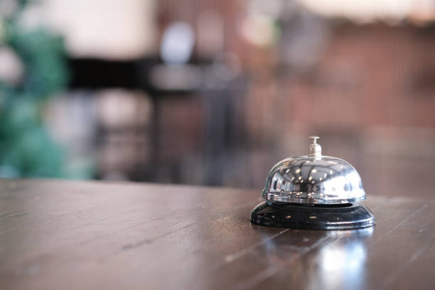 istock Hotel reception counter desk with service bell. 1214652672