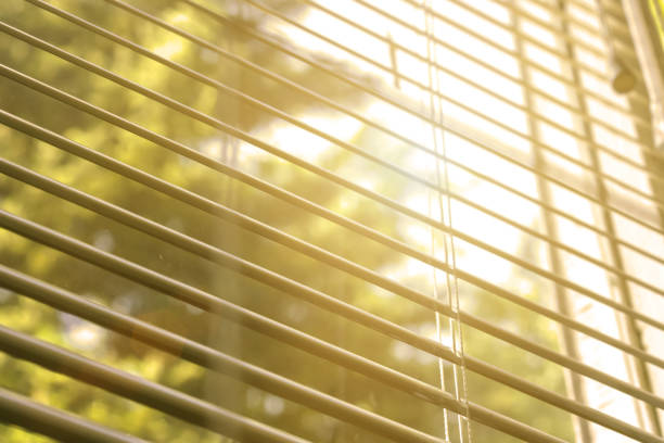 istock open wooden shutters on bedroom window 1214652734